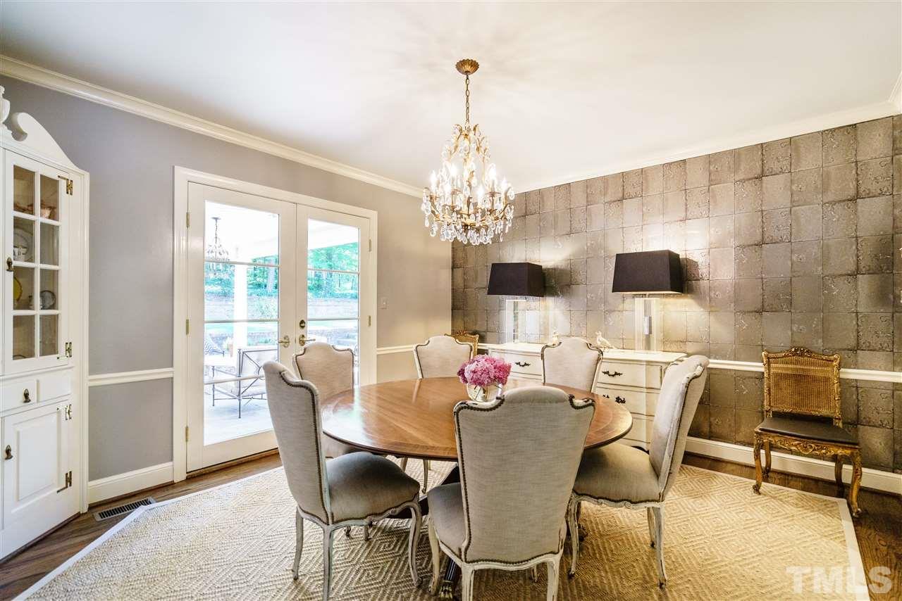 3300 Landor Road Raleigh, NC 27609 - Photo 9 of 25 a view of a dining room with furniture and chandelier