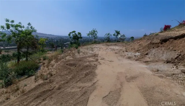 a view of a beach with a mountain in the background