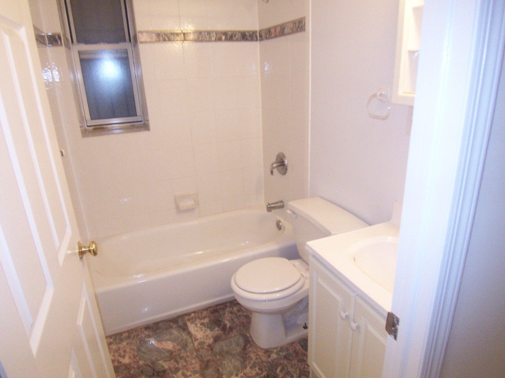 57 Sip Avenue, Unit 1A Jersey City, NJ 07306 - Photo 8 of 8 a bathroom with a toilet and a shower