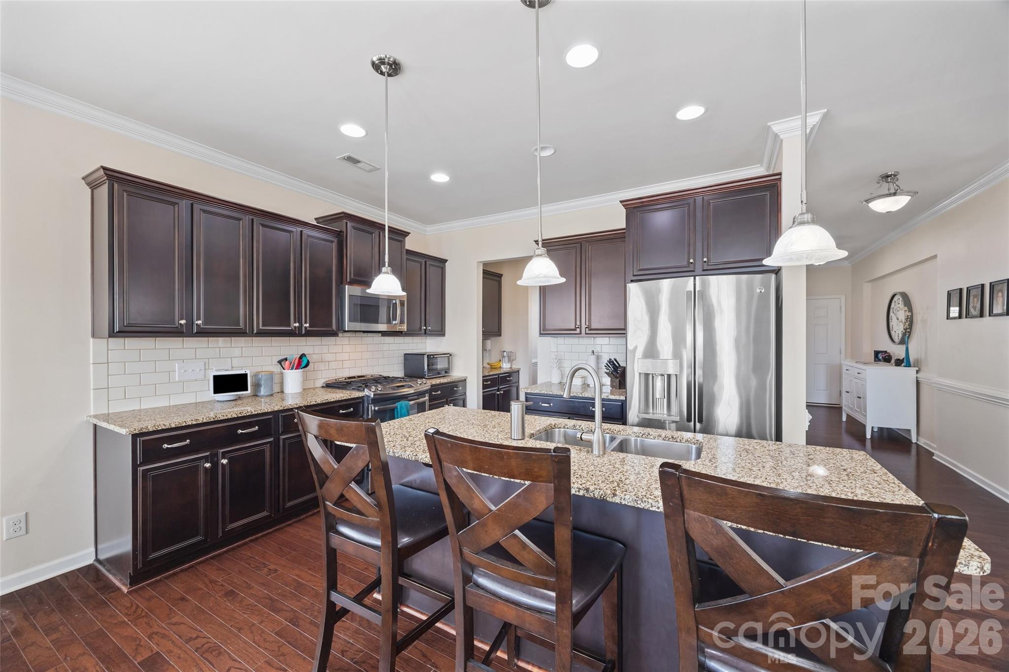 327 Hawks Creek Parkway Fort Mill, SC 29708 - Photo 11 of 48 a kitchen with stainless steel appliances granite countertop a sink a stove a refrigerator and cabinets