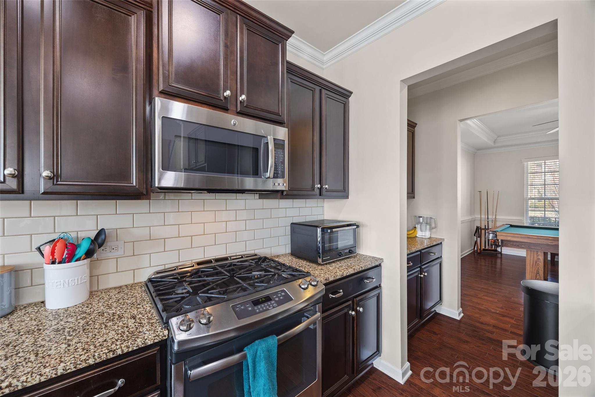 327 Hawks Creek Parkway Fort Mill, SC 29708 - Photo 12 of 48 a kitchen with stainless steel appliances granite countertop a stove a microwave and sink