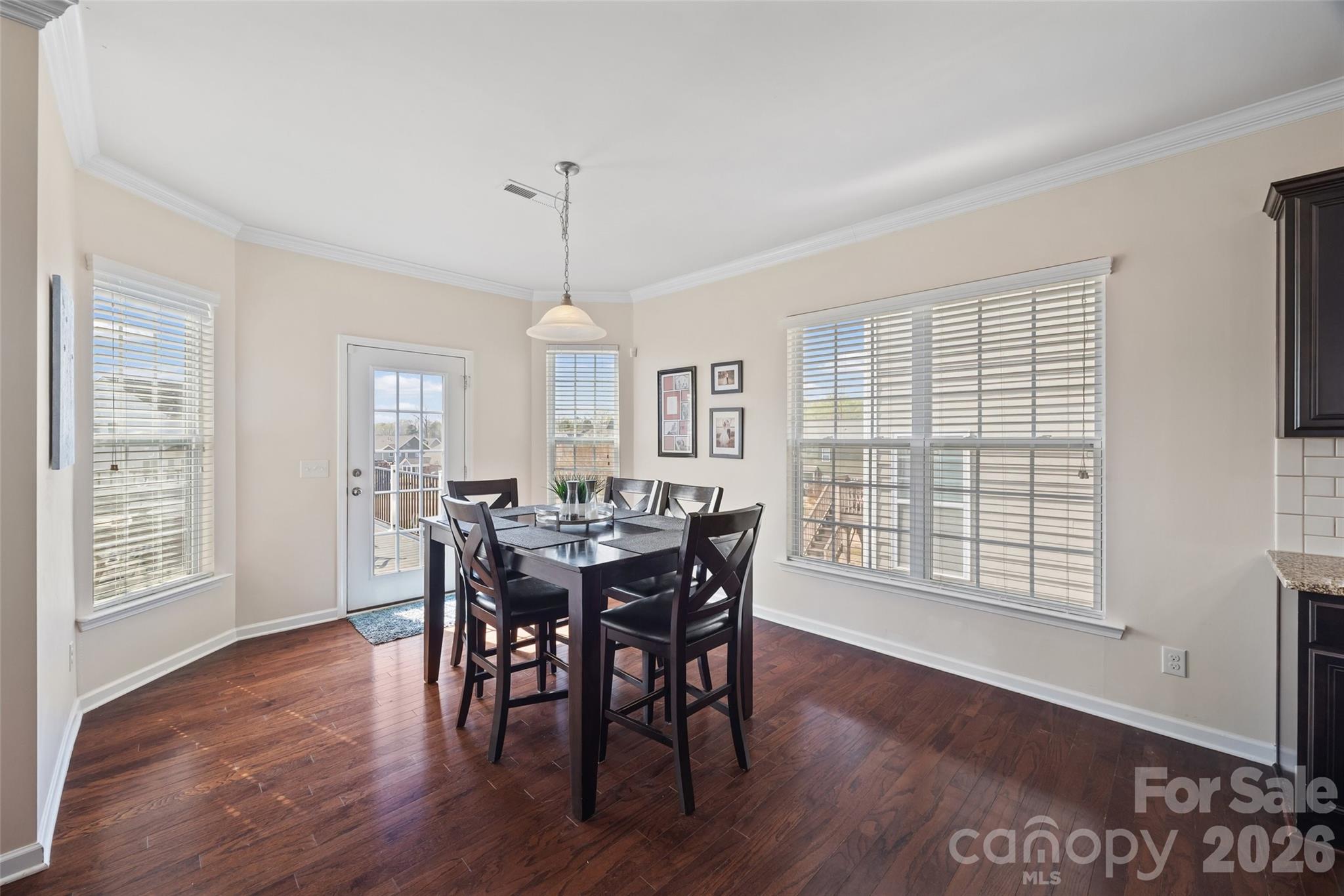 327 Hawks Creek Parkway Fort Mill, SC 29708 - Photo 14 of 48 a view of a dining room with furniture window and wooden floor