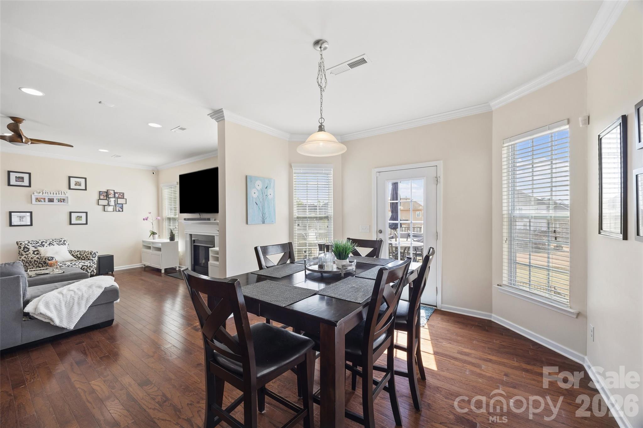 327 Hawks Creek Parkway Fort Mill, SC 29708 - Photo 15 of 48 a view of a dining room with furniture window and wooden floor