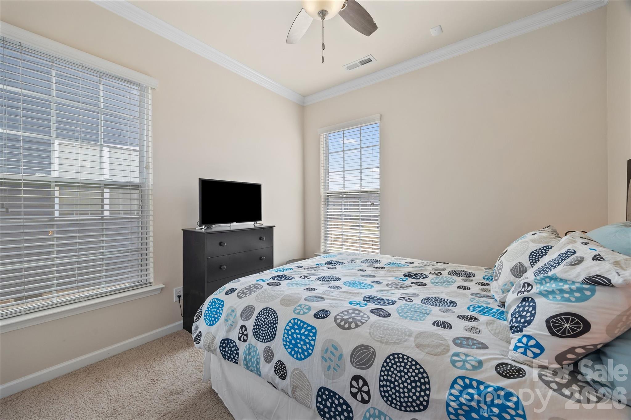 327 Hawks Creek Parkway Fort Mill, SC 29708 - Photo 21 of 48 a bedroom with a bed and a window