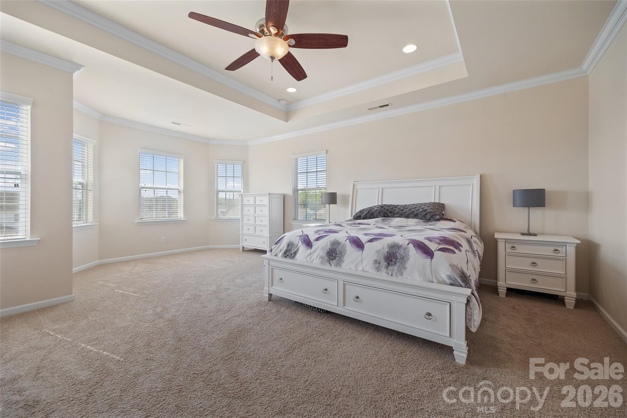 327 Hawks Creek Parkway Fort Mill, SC 29708 - Photo 23 of 48 a bedroom with a bed and a chandelier