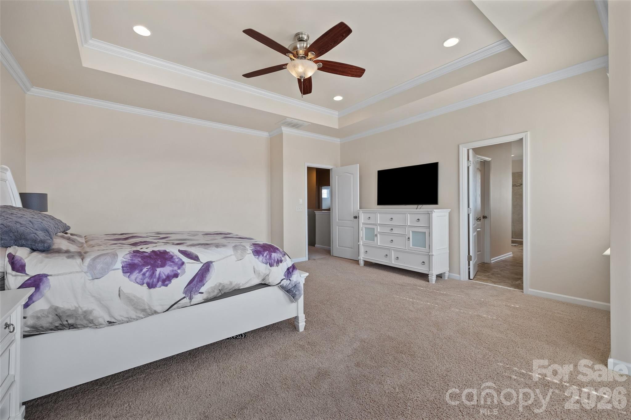 327 Hawks Creek Parkway Fort Mill, SC 29708 - Photo 25 of 48 a spacious bedroom with a bed and a flat screen tv