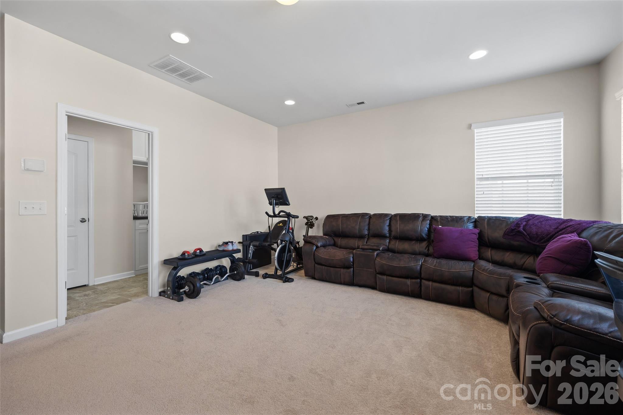 327 Hawks Creek Parkway Fort Mill, SC 29708 - Photo 30 of 48 a living room with furniture a bed and gym equipment