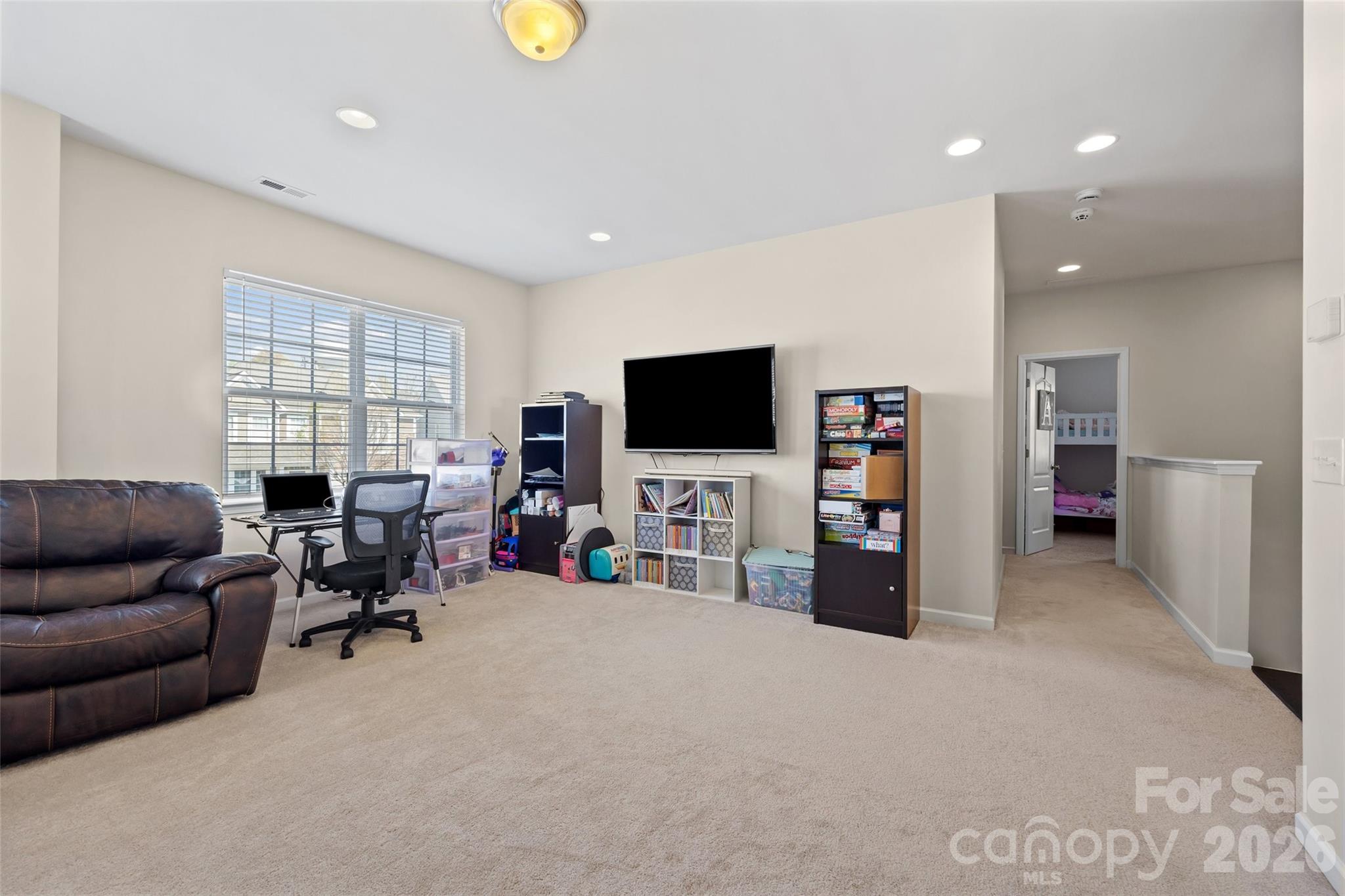 327 Hawks Creek Parkway Fort Mill, SC 29708 - Photo 31 of 48 a living room with furniture and a flat screen tv
