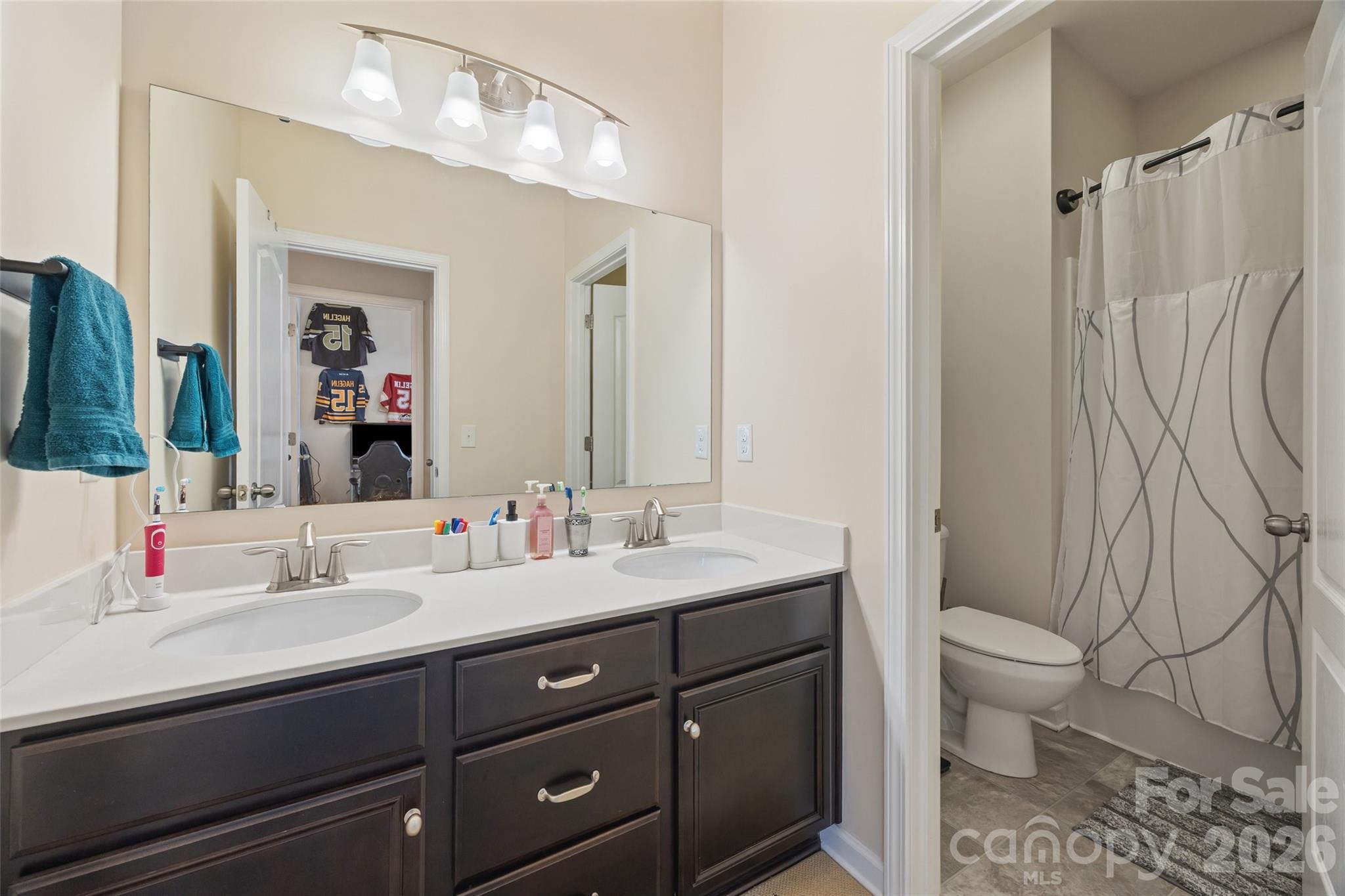 327 Hawks Creek Parkway Fort Mill, SC 29708 - Photo 35 of 48 a bathroom with a double vanity sink mirror and toilet