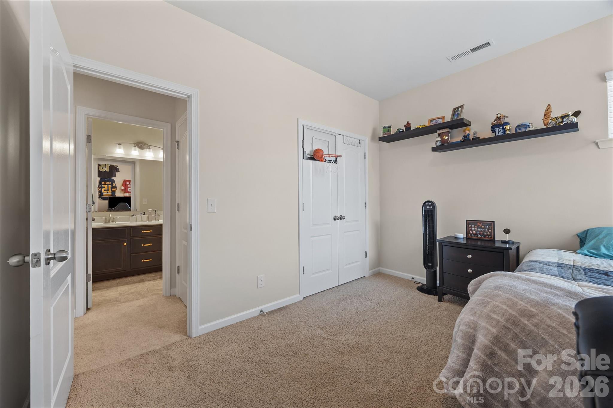 327 Hawks Creek Parkway Fort Mill, SC 29708 - Photo 38 of 48 a bedroom with a bed and cabinets