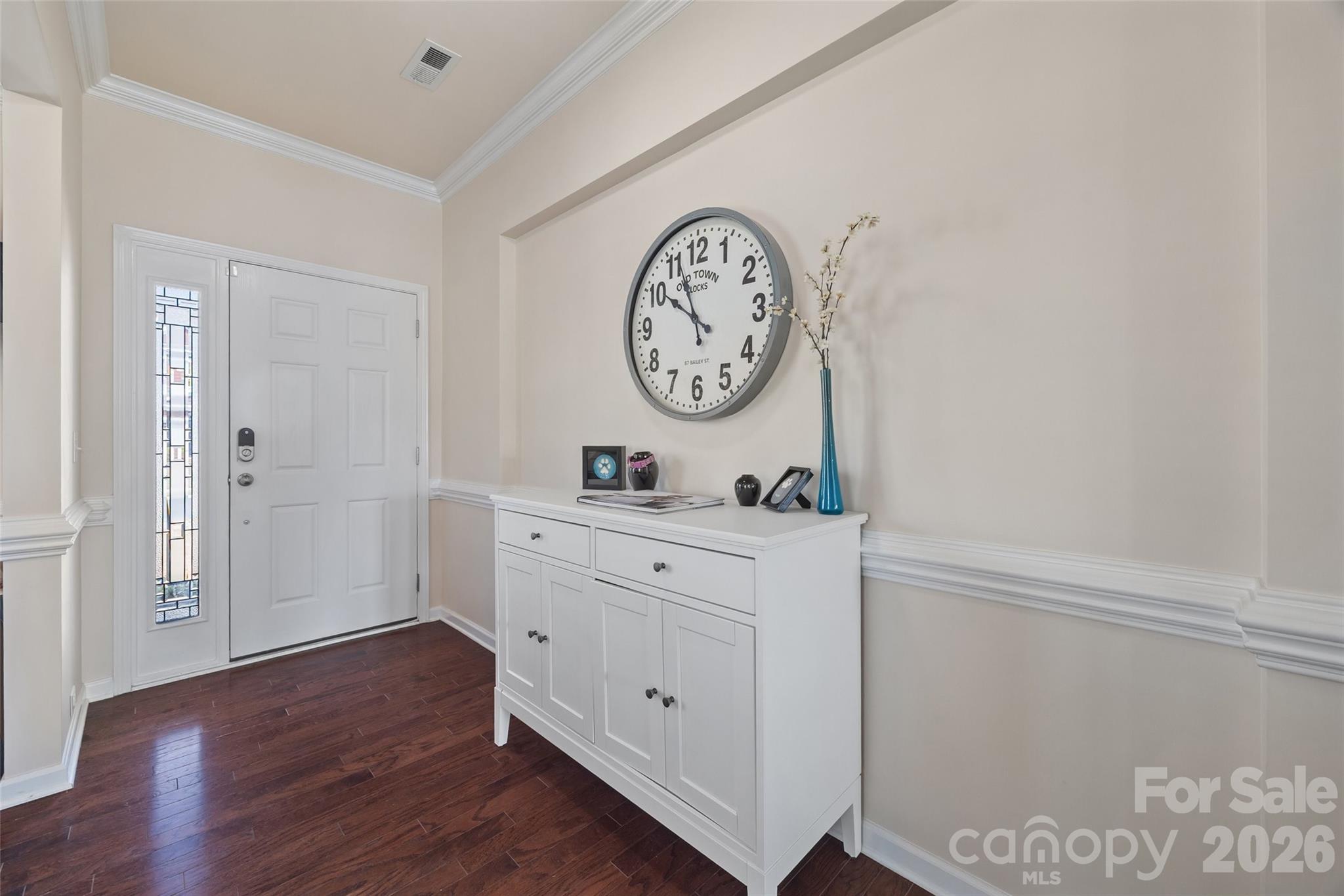 327 Hawks Creek Parkway Fort Mill, SC 29708 - Photo 4 of 48 a room with painting on the wall and a clock
