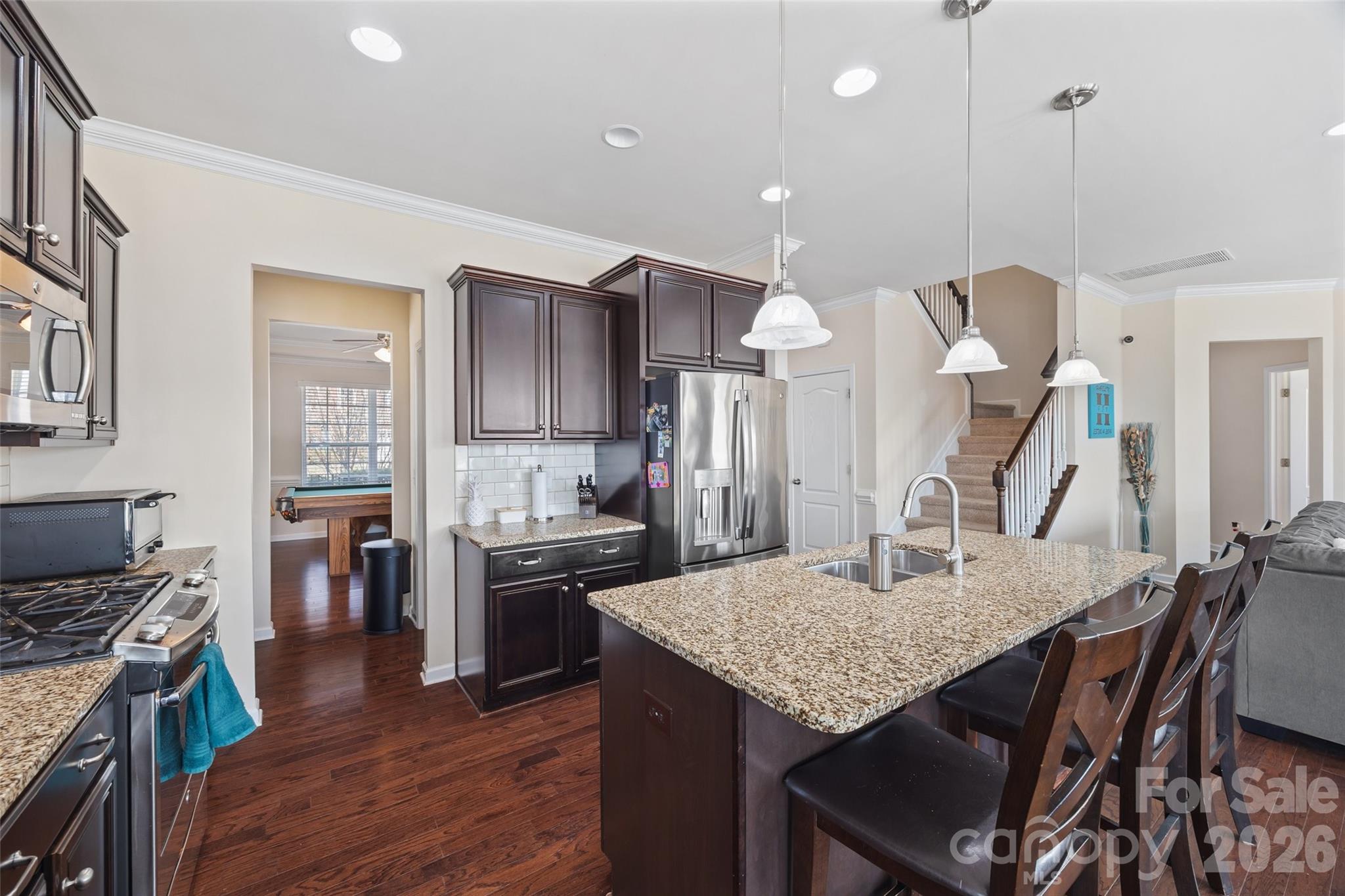 327 Hawks Creek Parkway Fort Mill, SC 29708 - Photo 10 of 48 a kitchen with a table chairs and wooden floor