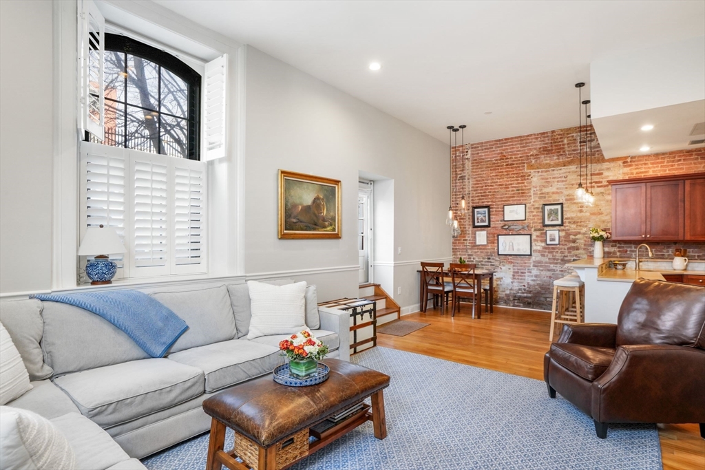 68 Baldwin Street, Unit 1 Boston, MA 02129 - Photo 2 of 19 a living room with furniture and a potted plant
