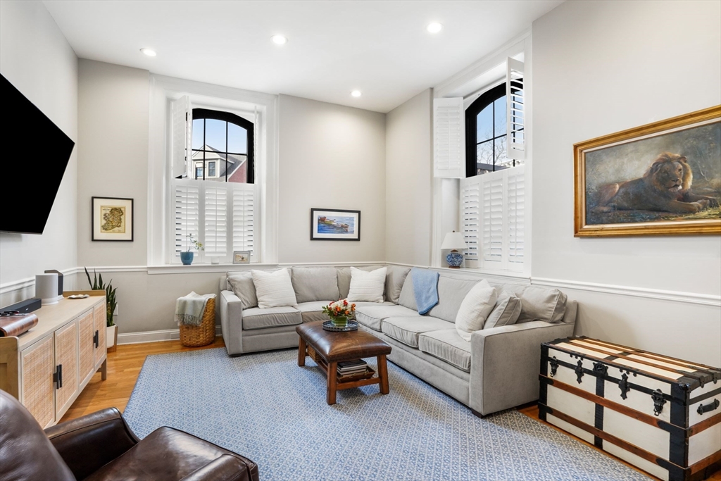 68 Baldwin Street, Unit 1 Boston, MA 02129 - Photo 4 of 19 a living room with furniture and a flat screen tv
