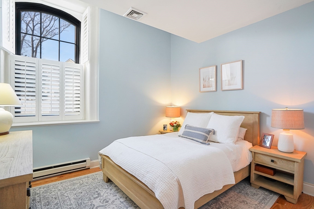 68 Baldwin Street, Unit 1 Boston, MA 02129 - Photo 9 of 19 a bedroom with a bed and a window