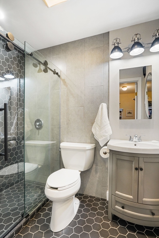 68 Baldwin Street, Unit 1 Boston, MA 02129 - Photo 10 of 19 a bathroom with a toilet sink and shower