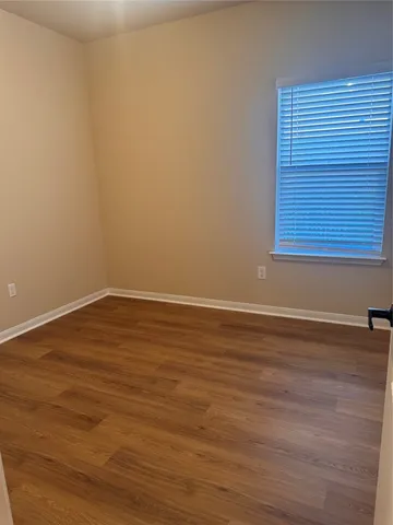 a white toilet sitting next to a bath tub