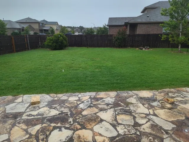 a view of a room with wooden floor and a window