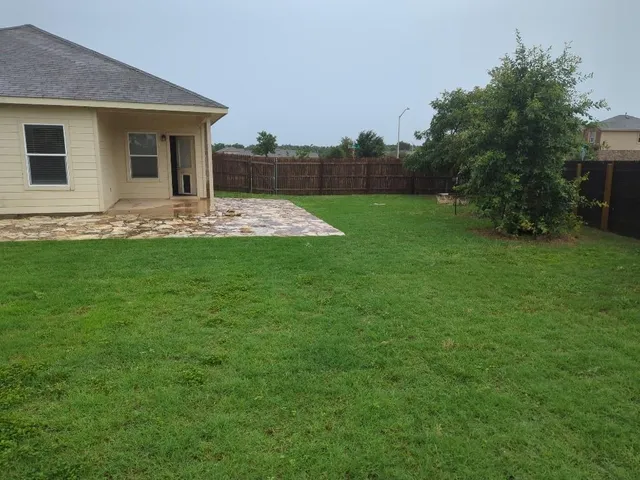 a view of a backyard with a garden