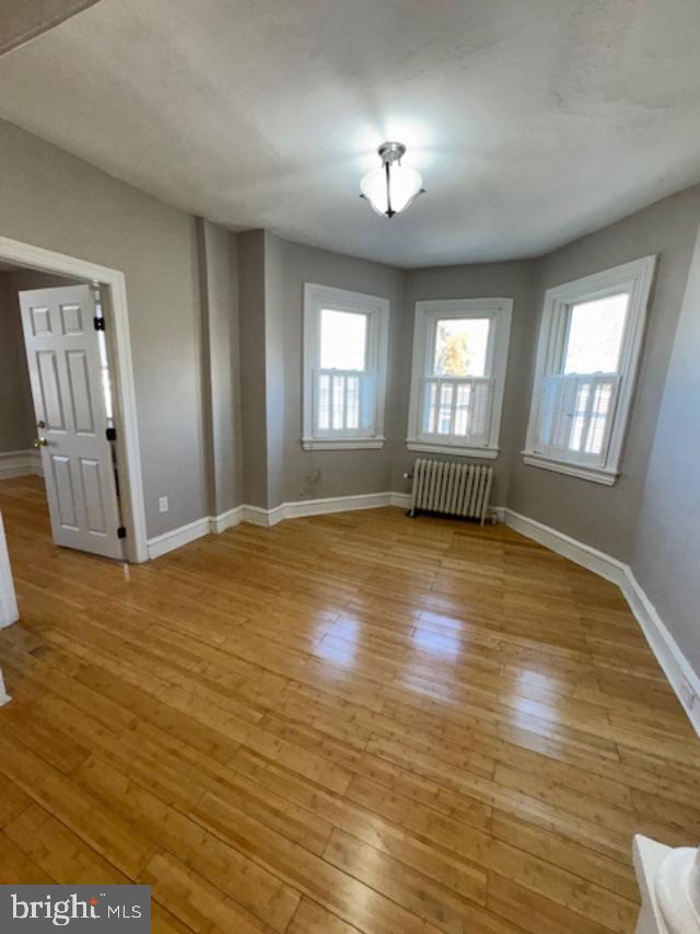 4 West Athens Avenue Ardmore, PA 19003 - Photo 14 of 30 a view of an empty room with window and wooden floor
