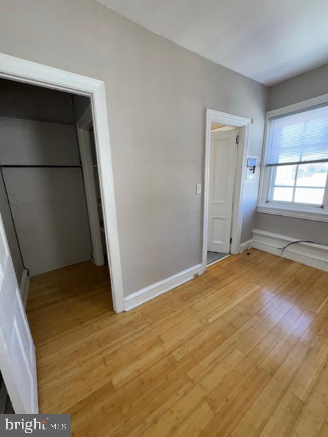 4 West Athens Avenue Ardmore, PA 19003 - Photo 23 of 30 an empty room with wooden floor and windows