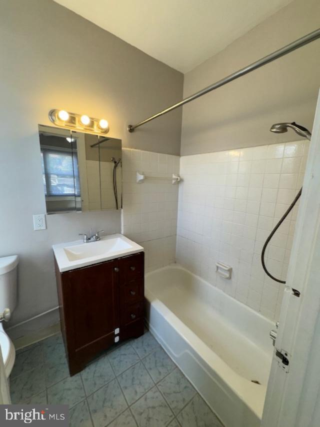 4 West Athens Avenue Ardmore, PA 19003 - Photo 25 of 30 a bathroom with a sink vanity granite tub shower and toilet