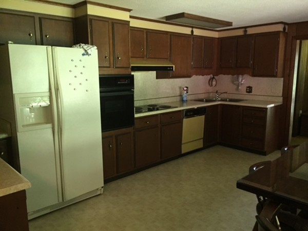 130 Athol Road Orange, MA 01364 - Photo 12 of 20 a kitchen with granite countertop a refrigerator and a sink