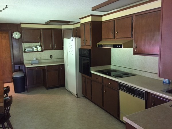 130 Athol Road Orange, MA 01364 - Photo 13 of 20 a kitchen with stainless steel appliances granite countertop a refrigerator a sink and a stove