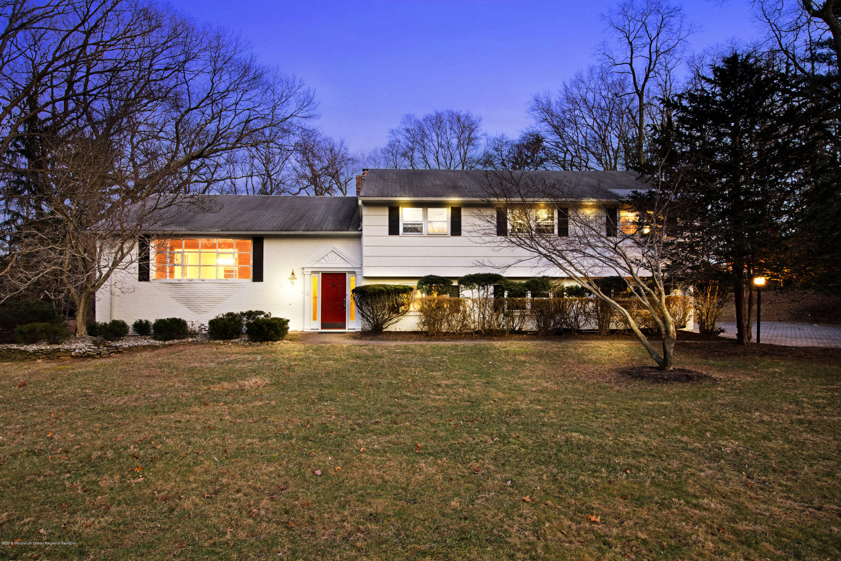 2 Old Farm Road Colts Neck, NJ 07722 - Photo 1 of 56 a front view of a house with a yard and garage