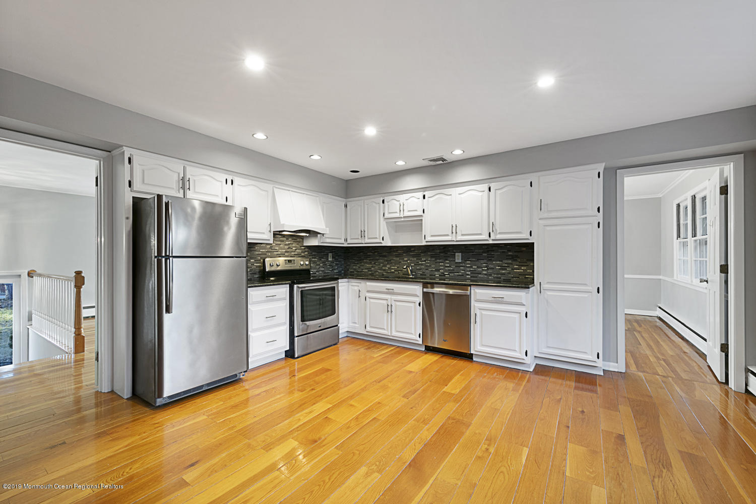 2 Old Farm Road Colts Neck, NJ 07722 - Photo 15 of 56 a large kitchen with a refrigerator and a stove top oven