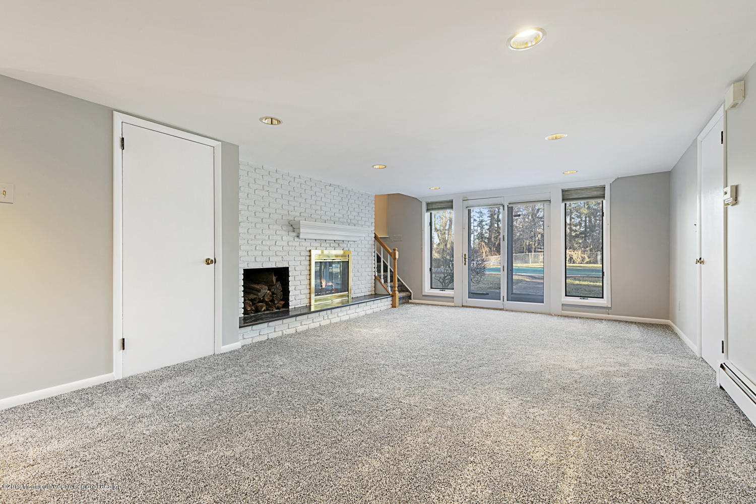 2 Old Farm Road Colts Neck, NJ 07722 - Photo 24 of 56 a view of an empty room with a fireplace and a window