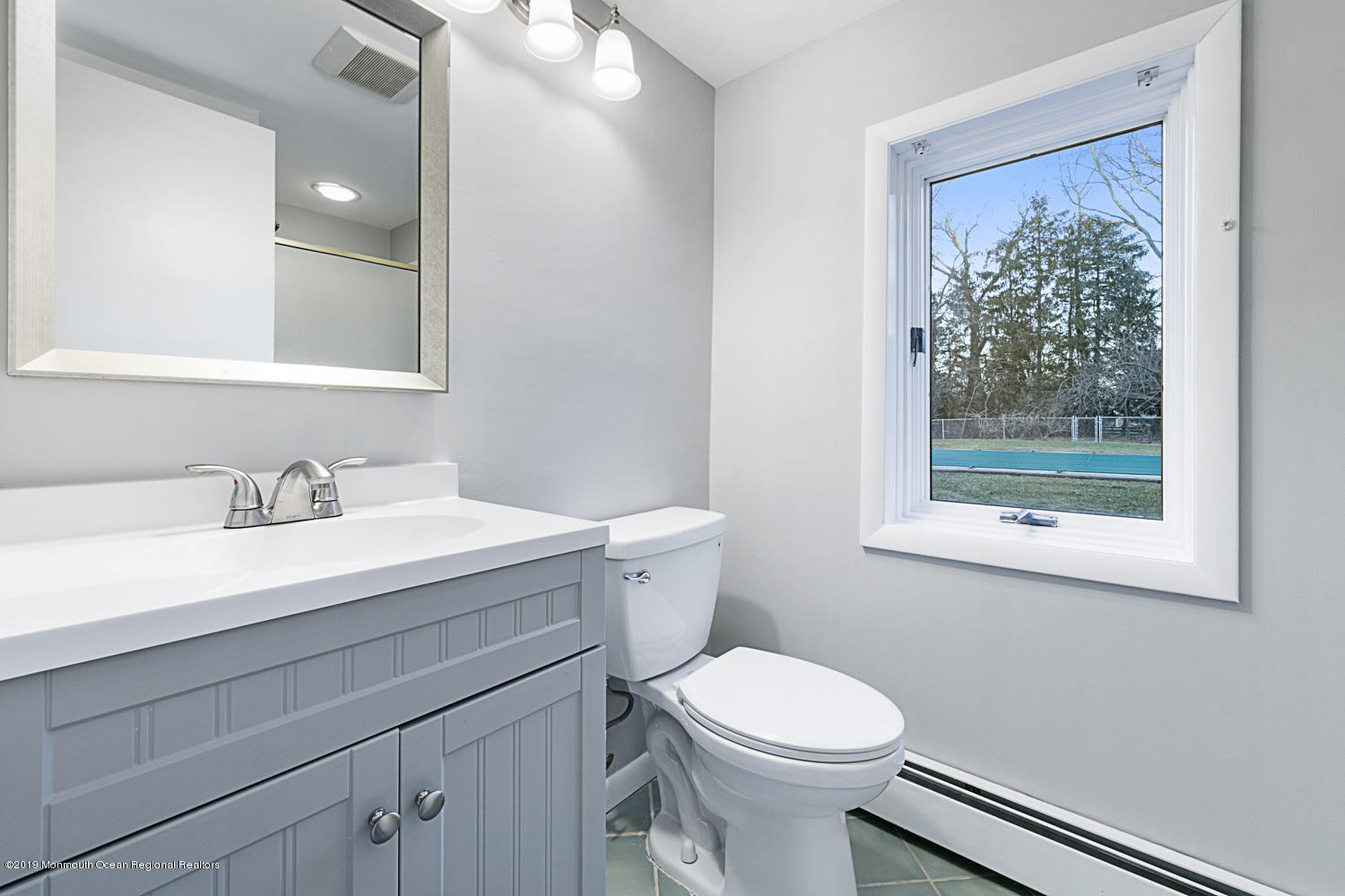 2 Old Farm Road Colts Neck, NJ 07722 - Photo 25 of 56 a bathroom with a sink a toilet and a window