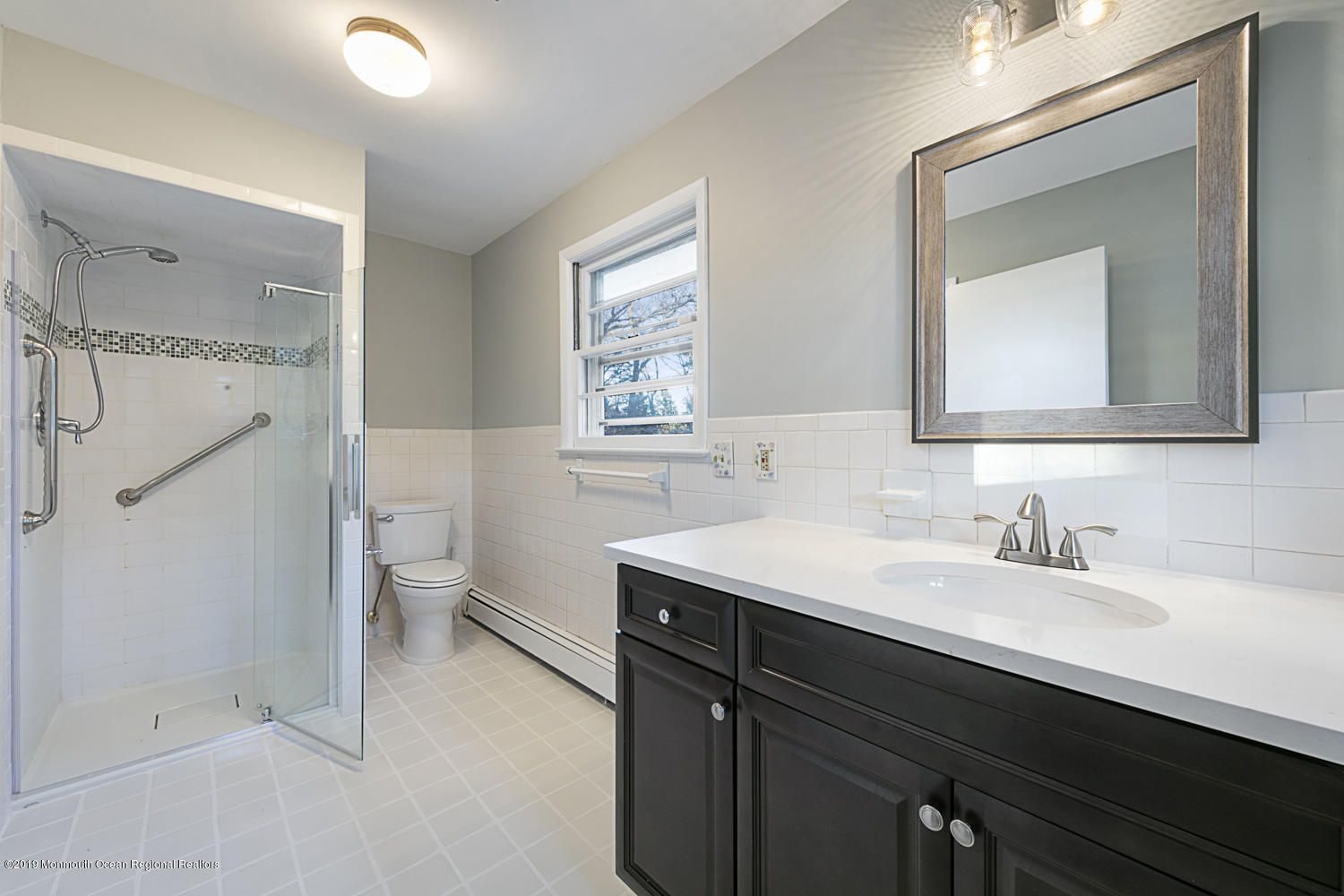 2 Old Farm Road Colts Neck, NJ 07722 - Photo 34 of 56 a bathroom with a double vanity sink mirror and toilet
