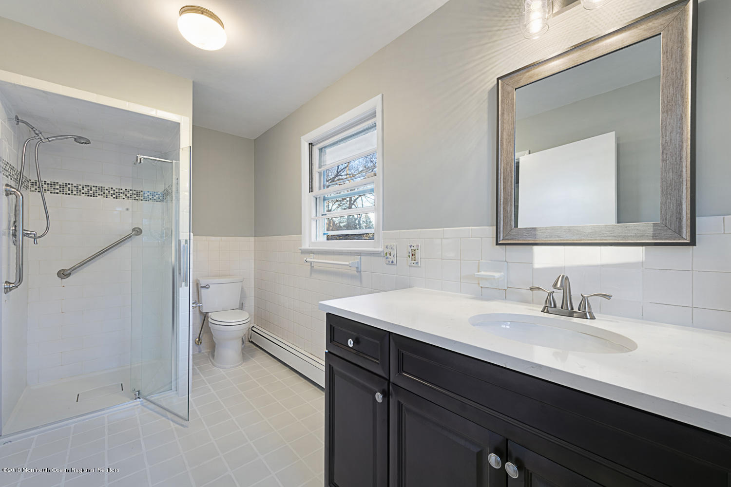 2 Old Farm Road Colts Neck, NJ 07722 - Photo 35 of 56 a bathroom with a sink a toilet a mirror and shower
