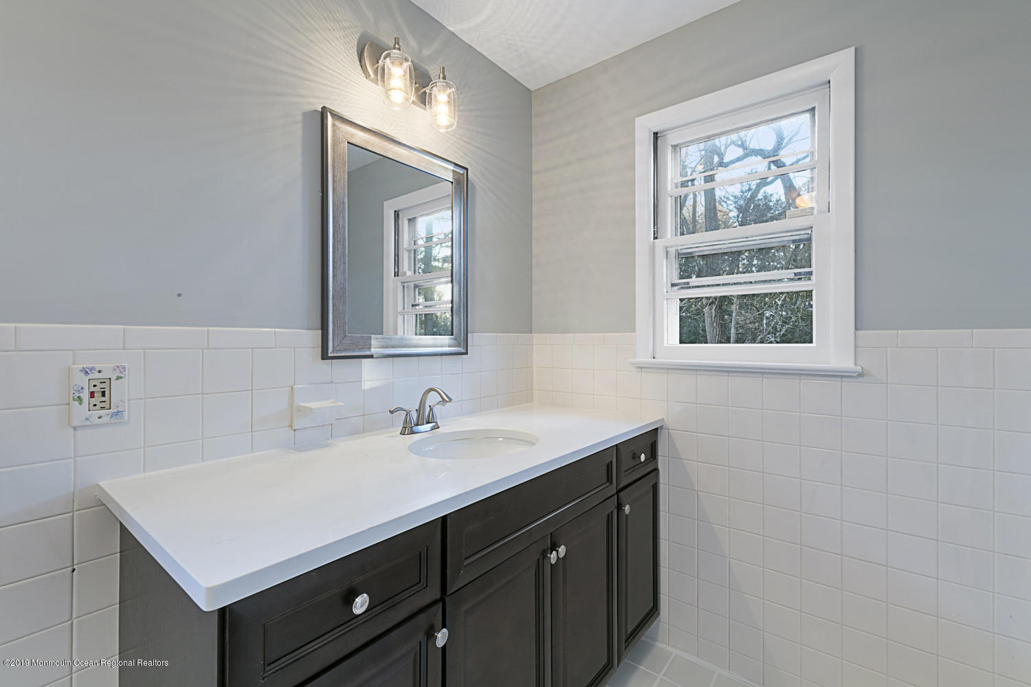 2 Old Farm Road Colts Neck, NJ 07722 - Photo 36 of 56 a bathroom with a sink and a mirror