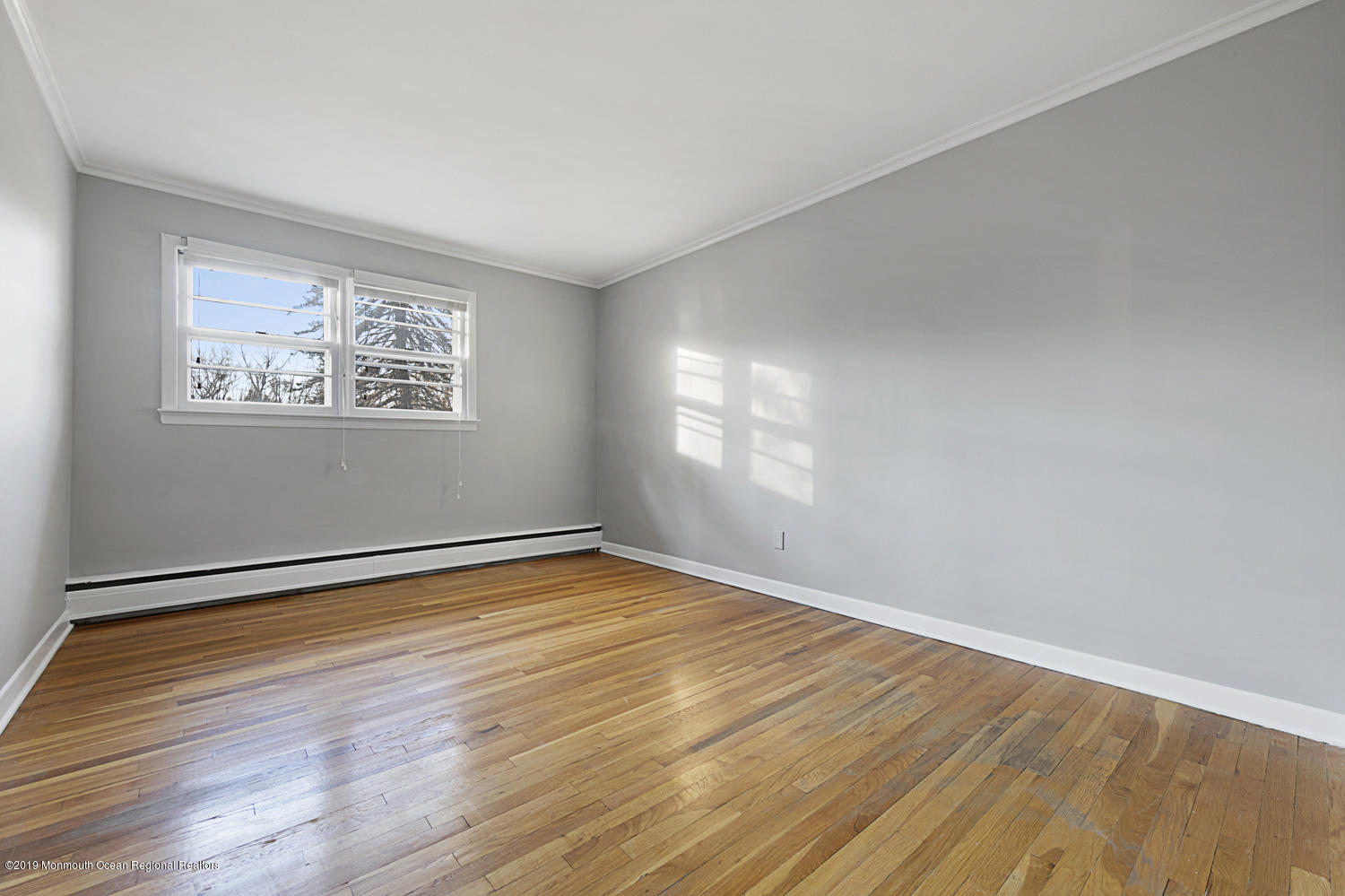 2 Old Farm Road Colts Neck, NJ 07722 - Photo 38 of 56 wooden floor in an empty room with a window