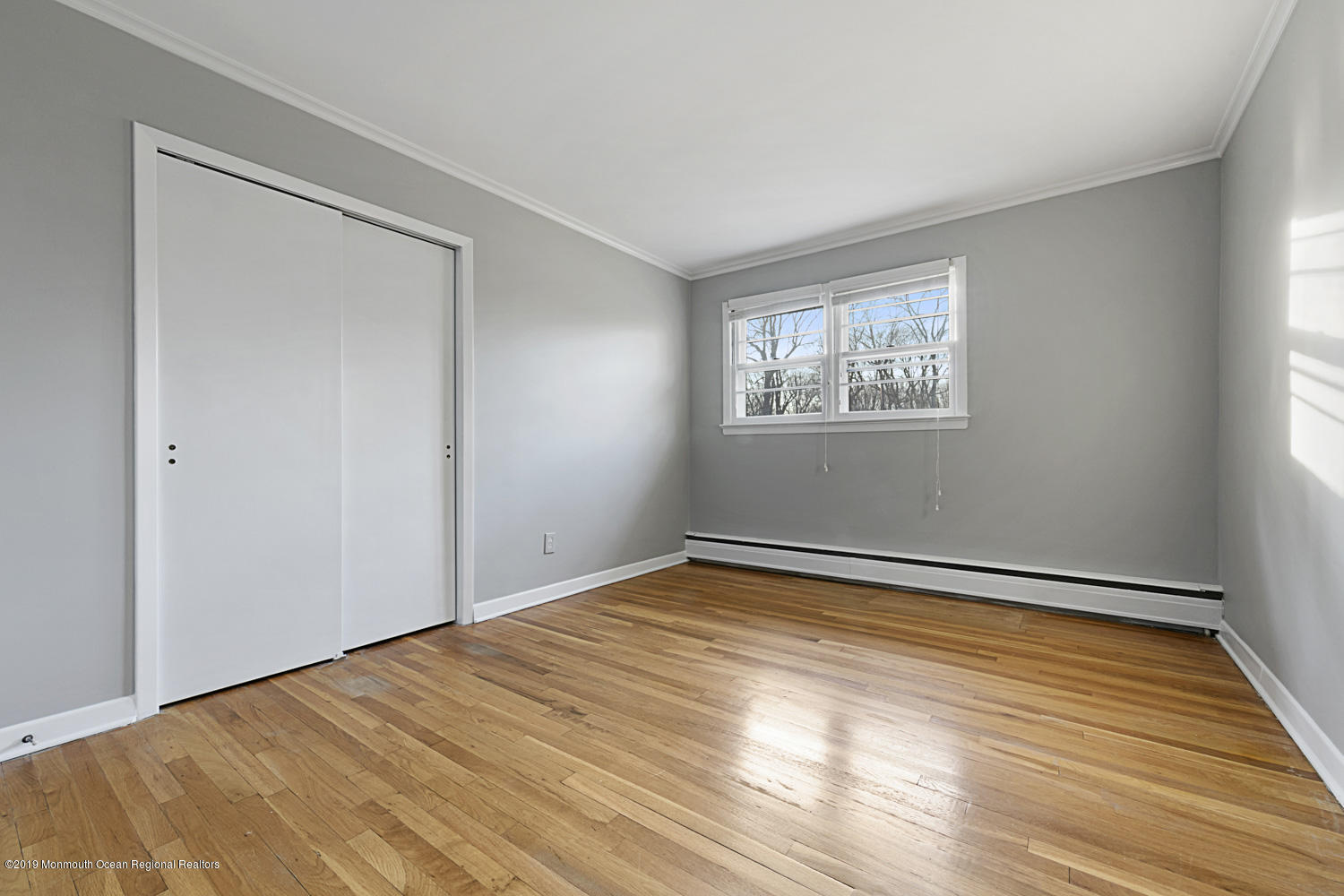 2 Old Farm Road Colts Neck, NJ 07722 - Photo 39 of 56 a view of an empty room with wooden floor and a window