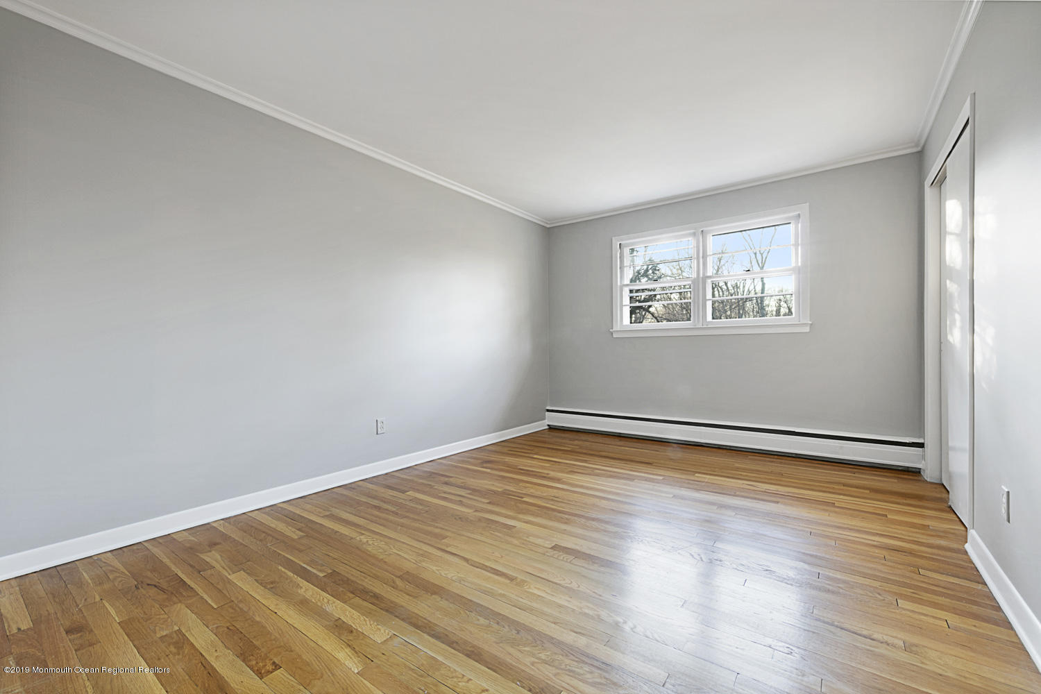 2 Old Farm Road Colts Neck, NJ 07722 - Photo 40 of 56 a view of an empty room with wooden floor and a window