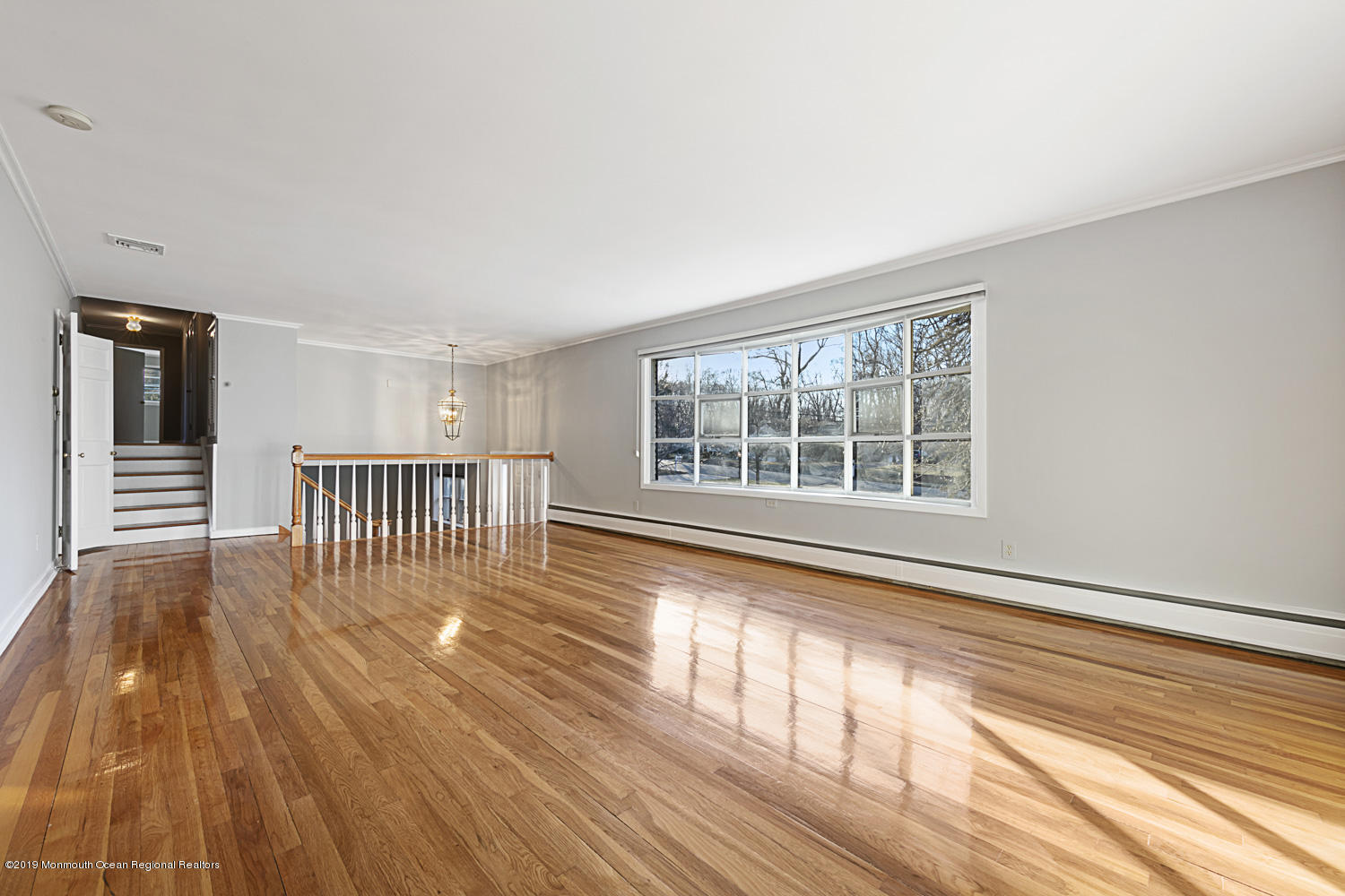 2 Old Farm Road Colts Neck, NJ 07722 - Photo 5 of 56 a view of an empty room with wooden floor and a window
