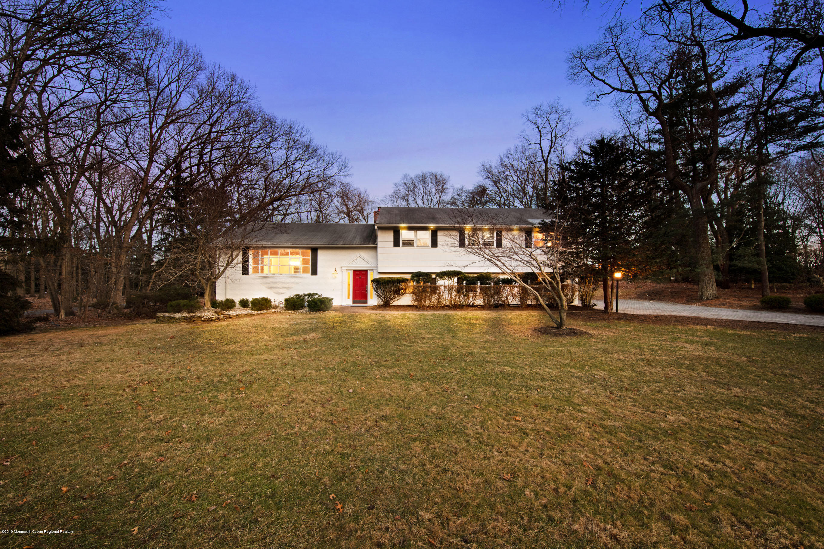 2 Old Farm Road Colts Neck, NJ 07722 - Photo 53 of 56 a front view of a house with a yard and trees