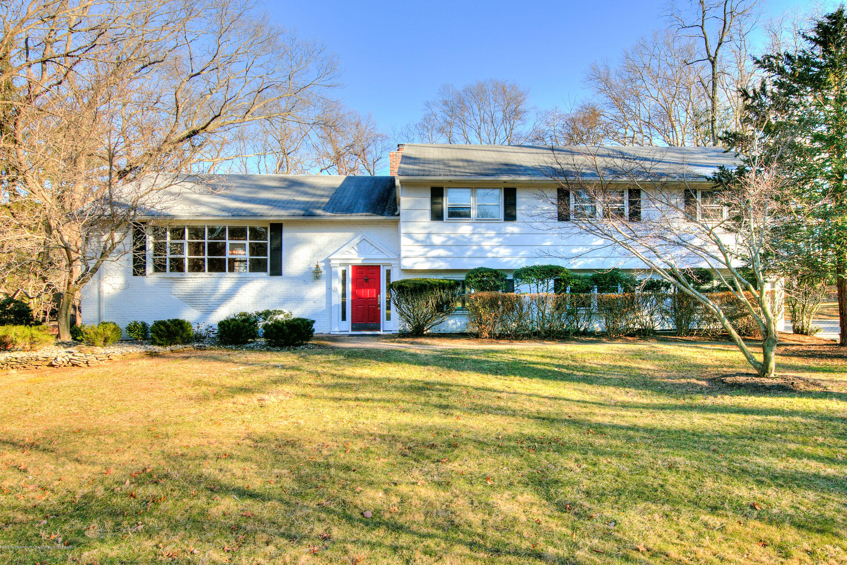 2 Old Farm Road Colts Neck, NJ 07722 - Photo 56 of 56 a front view of a house with a yard table and chairs