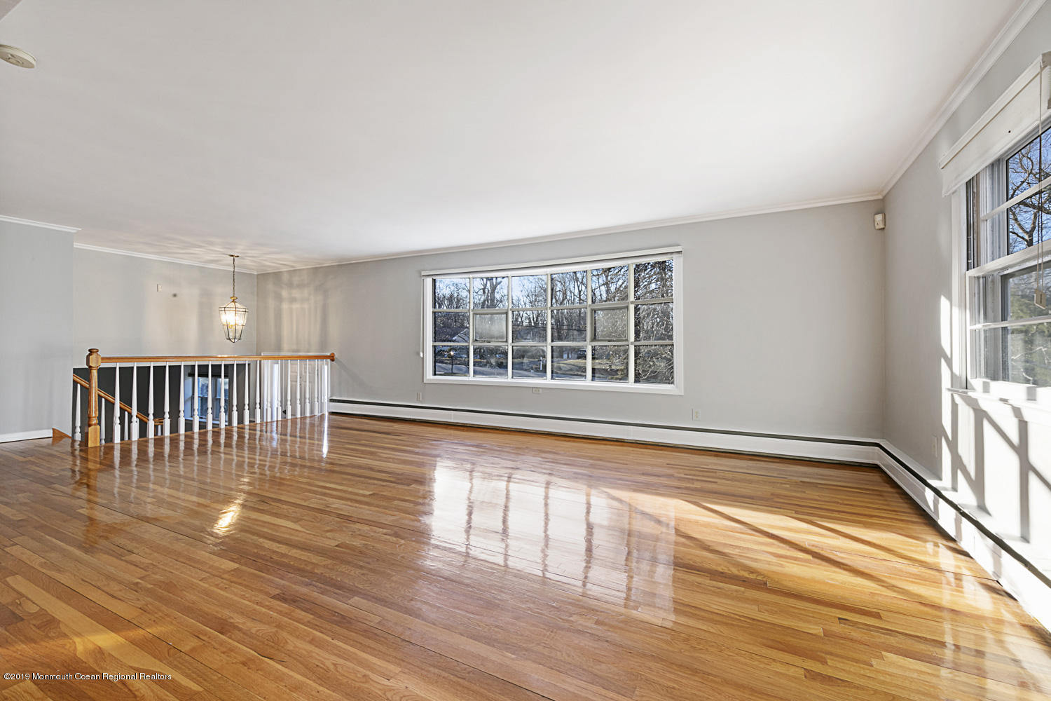 2 Old Farm Road Colts Neck, NJ 07722 - Photo 6 of 56 a view of an empty room with wooden floor and a window