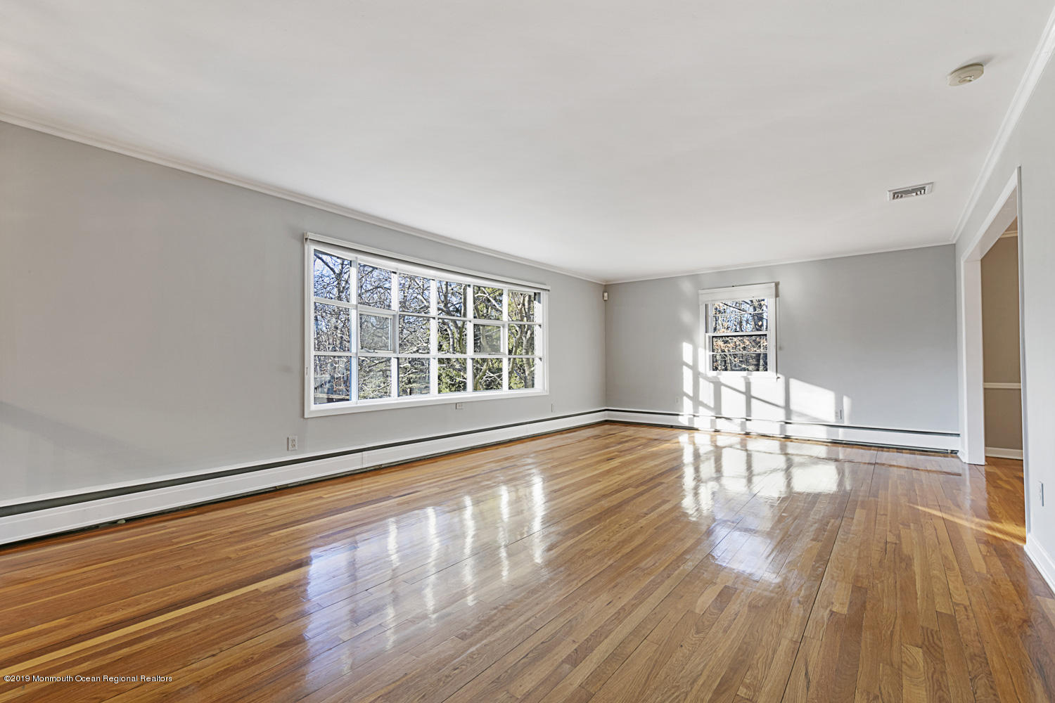 2 Old Farm Road Colts Neck, NJ 07722 - Photo 8 of 56 a view of empty room with wooden floor and fan
