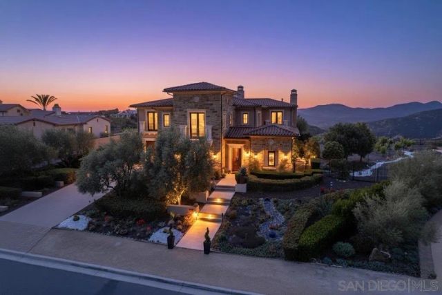 a view of a big yard with potted plants