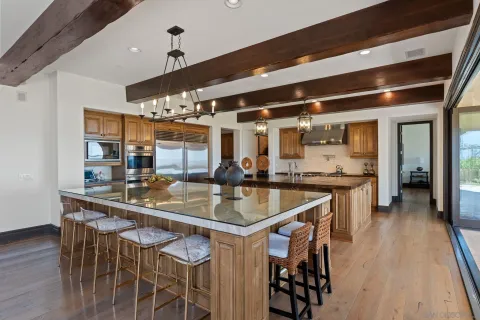 a kitchen with a table and chairs in it