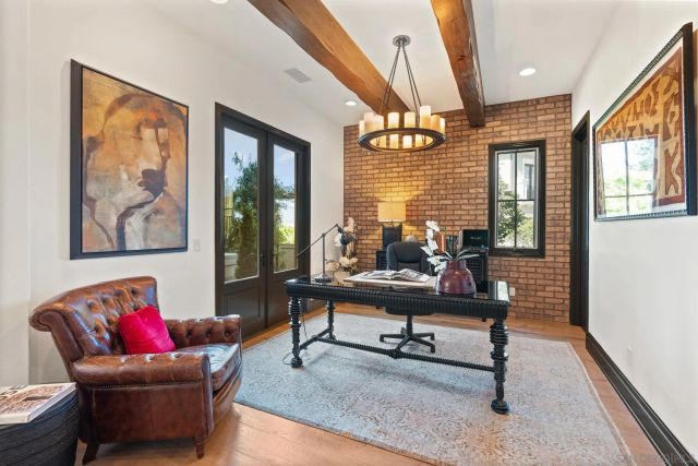 a living room with furniture a rug and a large window