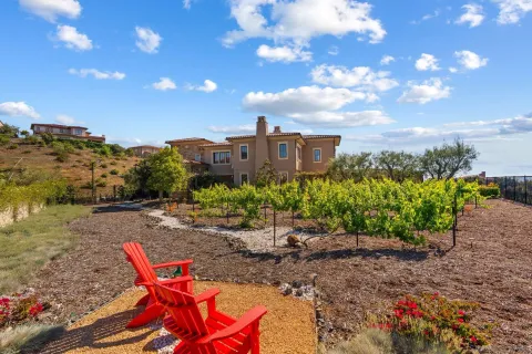 a view of a chairs in a backyard