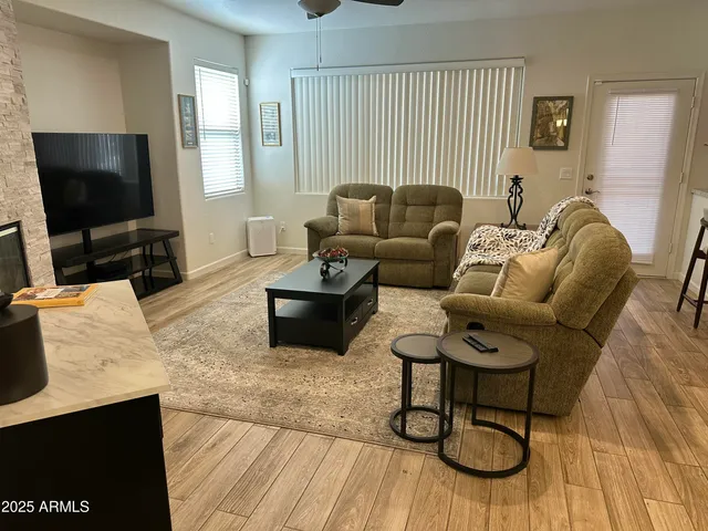 a backyard of a house with table and chairs