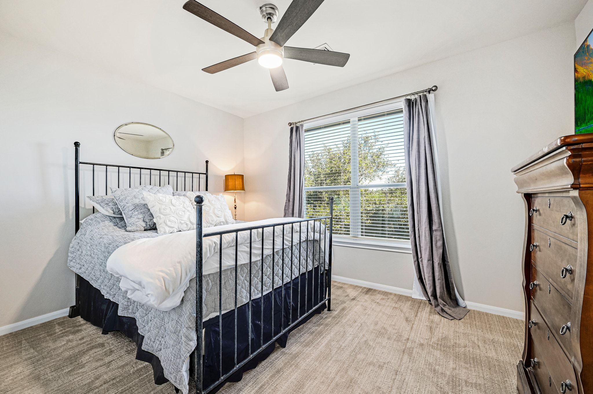 7112 Via Correto Drive Austin, TX 78749 - Photo 18 of 29 2nd Bedroom with light carpet and ceiling fan
