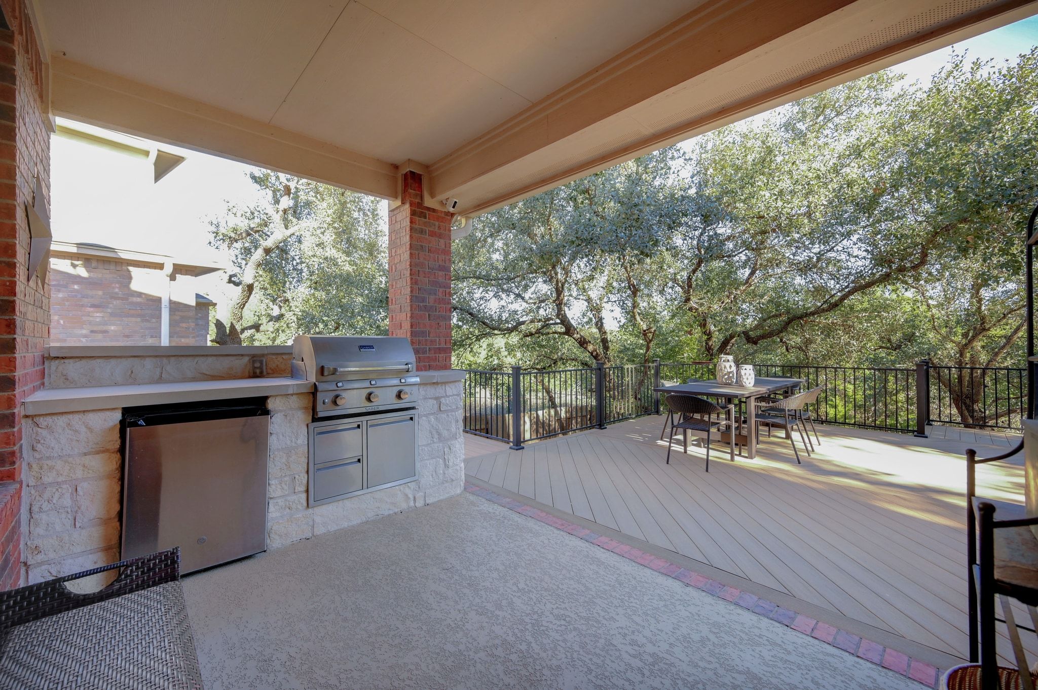 7112 Via Correto Drive Austin, TX 78749 - Photo 24 of 29 View of covered patio / terrace featuring an outdoor kitchen / dining area and a deck